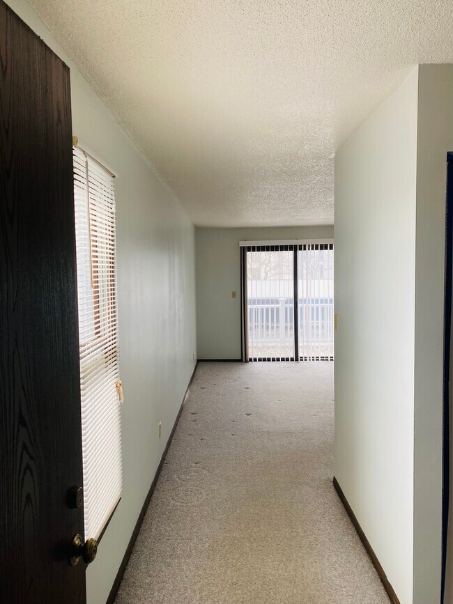 View through the front door. Balcony off the main room. - 2618 W Willowlake Dr