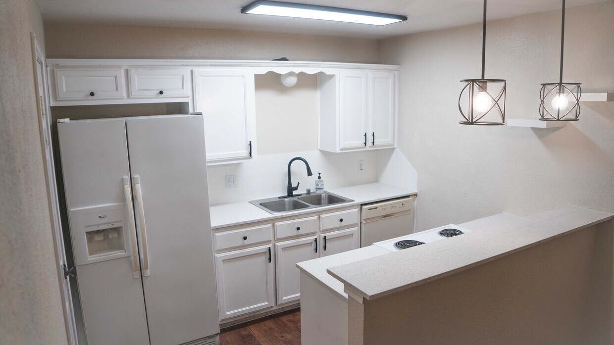 Open kitchen with bar that connects to dining area - 1231 Wood Ave