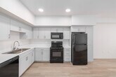 This contemporary 1,130 square foot single-story residence in San Diego offers a well-designed layout with four bedrooms and two bathrooms. The heart of the home is an open-concept living area that seamlessly integrates with a modern kitchen. The kitchen boasts crisp white cabinetry, stainless steel appliances, and a functional L-shaped design with ample counter space.

The primary bedroom, measuring 150 square feet, provides a generous retreat. All bedrooms feature light-toned hardwood flooring and large windows that flood the spaces with natural light. The bathrooms are updated with clean lines, featuring white fixtures and vanities that complement the home's modern aesthetic.

Throughout the property, you'll find a cohesive design with neutral color palettes and minimalist finishes. The home's single-story layout ensures easy accessibility, while two hallways facilitate smooth circulation. A dedicated closet space offers additional storage solutions.

Large windows in the living areas and bedrooms not only brighten the interiors but also provide views of the surrounding neighborhood. The overall ambiance is one of contemporary comfort, making this property an ideal blend of style and functionality in the desirable 92127 zip code of San Diego.