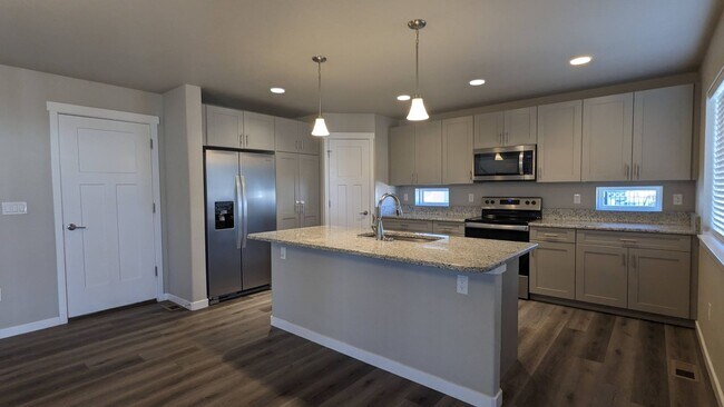 Building Photo - 4 Bedrooms | 3.5 Bathrooms | 2-Car Garage | Finished Walkout Basement | Fenced Yard | Pikes Peak ...