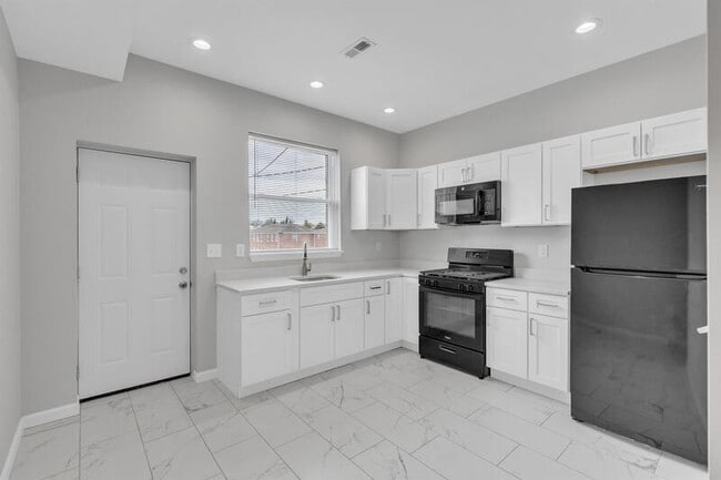 Building Photo - 3849 Wilkens Avenue - 1