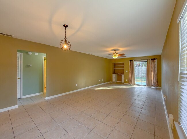 Photo - LOVELY & Modern NW 2/1 w/ New Flooring & Huge Privacy Fenced Yard that Inc Lawn Maintenance! Avai... Townhome