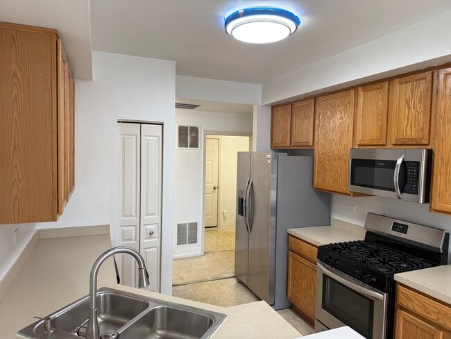 Building Photo - Partially Furnished - Bright & Spacious 2BR/1.5 BA CONDO - End-Unit w/ 2-Car Garage, Appliances, ...