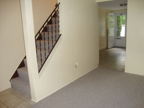 Living room looking toward kitchen entry and parking area. - 686 Charlotte Ave