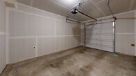 Located at 2920 Falk Rd in Vancouver, WA, this three-story home offers a well-organized layout across three distinct levels. The ground floor houses an attached garage with an automatic opener, utility spaces, and interior access doors, providing convenient and secure entry. The main living level features an open-plan kitchen and dining area outfitted with white shaker cabinetry, stainless steel appliances including a range, microwave, dishwasher, and refrigerator, complemented by warm hardwood-style flooring and recessed lighting. A living room, pantry, entrance, and a bathroom round out this floor. The upper level is home to three carpeted bedrooms, each featuring sliding closet doors and windows that allow natural light and neighborhood views. Three full bathrooms are distributed throughout the home, finished with white vanities and hardwood-style flooring. Additional conveniences include a dedicated laundry room, multiple hallways for easy circulation, and a patio for outdoor enjoyment. The home's clean, neutral palette with light walls and modern finishes creates a bright, functional living environment suited for everyday comfort.