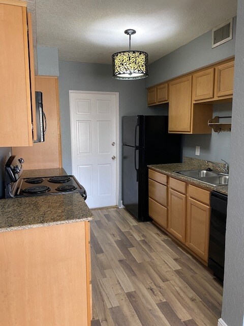 Kitchen/Back door to parking - 225 E New Hampshire St