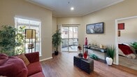 Located in Dallas, TX, this thoughtfully designed one-bedroom, one-bathroom residence maximizes its compact footprint with a smart, functional layout across a single floor. The open-concept living area features rich hardwood-style flooring, crown molding, and neutral warm-toned walls that create a welcoming ambiance throughout. Multiple windows fitted with blinds allow natural light to filter in, while a sliding glass door in the living room opens directly onto a private outdoor patio, seamlessly connecting interior and exterior spaces.

The kitchen is well-appointed with white cabinetry accented by wood trim, light granite-style countertops, black appliances including a refrigerator and electric range, and a breakfast bar that provides additional seating and counter space. The open pass-through design keeps the kitchen connected to the main living area.

The bedroom offers a cozy, carpeted retreat with a large window, mirrored sliding closet doors providing ample storage, and wall space that lends itself well to personalization. The bathroom features wood-style flooring, a wide vanity with generous counter space, a large mirror, and a shower-tub combination. This residence offers a practical and comfortable living experience in a well-established Dallas neighborhood.