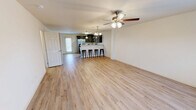 Located at 234 Mockingbird Ln in Johnson City, TN, this two-story home offers three bedrooms and three bathrooms across a well-designed layout. The main floor provides a generous open-concept living and dining area finished with light hardwood-style flooring and ceiling fans with integrated lighting. The kitchen is a standout feature, showcasing dark espresso cabinetry, granite-style countertops, stainless steel appliances, and a breakfast bar with pendant lighting — ideal for casual dining and entertaining. A rear door on the main level brings in natural light and provides outdoor access. Upstairs, the second floor hosts all three bedrooms, each outfitted with plush carpet flooring and ceiling fans. The primary bedroom is a comfortable retreat with a window offering natural light and access to a dedicated closet. Additional bedrooms each include their own closet storage. The three bathrooms are clean and functional, featuring white tub-shower surrounds with brushed nickel fixtures. Two utility rooms add practical storage and functional space. A staircase connects the two floors, and a hallway provides easy access to all upper-level rooms. The home's neutral color palette and consistent finishes throughout create a bright, cohesive atmosphere.