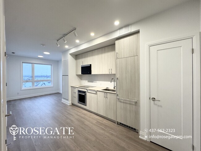 Photo du bâtiment - Modern 1 Bedroom + Den (Potential 2nd Bedroom) Condo with Parking & Balcony