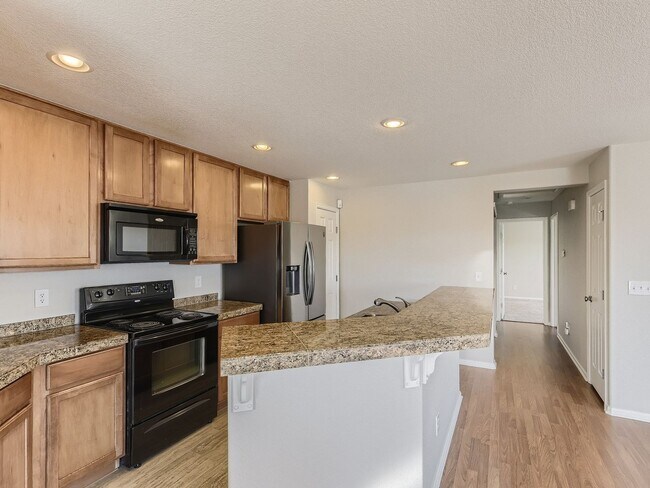 Building Photo - Evolve Real Estate: Spacious 2 Bed 2 Bath Condo with Attached Garage in Parker!