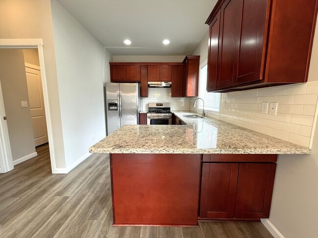 Building Photo - Well-Appointed 4BR/2.5BA Home with Spacious Living Areas & Modern Kitchen