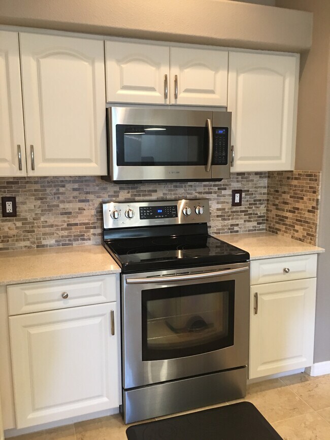 Stove/Microwave and custom tile backsplash - 3103 W Napoleon Ave