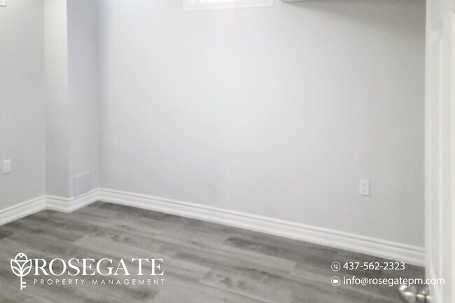 Photo du bâtiment - Bright 2-Bedroom Basement Apartment in Aja...