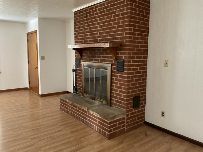 Living room wood burning fireplace - 153 Grandview Dr