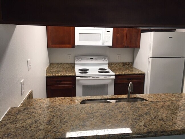 Foto del edificio - 7114 N Holiday Dr