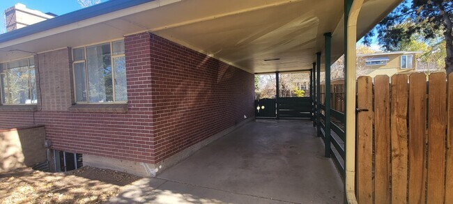 Single vehicle carport with backyard access - 5708 S Hickory Way