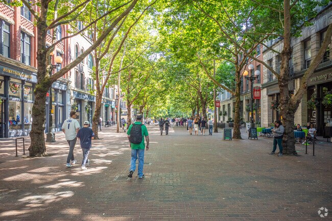 Residents enjoy spending time in Occidental Square during the summer in Pioneer Square.