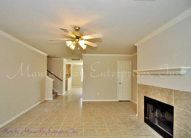 Living Area with Fireplace & Crown Molding - 8330 Wahl Manor Ct