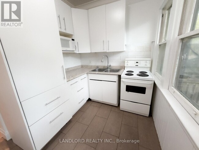 Building Photo - 2469 Queen St E