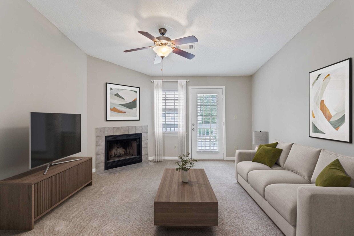 Living Room with Private Patio Access - Villages at Spring Hill Apartments