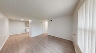 Located at 600 S Main Ct in Bixby, Oklahoma, this two-bedroom, one-bathroom single-floor unit offers a practical and well-organized layout. Throughout the home, light-toned luxury vinyl plank flooring creates a clean, cohesive look that ties each room together.

The living room serves as the central gathering space, featuring a textured ceiling, a large window with vertical blinds that welcomes natural light, and direct access to the front entry. The open sightline to the kitchen enhances the sense of space throughout the common area.

The kitchen is efficiently designed with gray cabinetry, light countertops, and white appliances including a gas range, over-the-range microwave, refrigerator, and dishwasher. A double-basin sink and under-cabinet range hood complete the functional setup.

Both bedrooms are bright and well-proportioned, each equipped with a ceiling fan with light fixture and closet storage. The primary bedroom features a sliding double-door closet, while the second bedroom includes a bi-fold closet door. Each room benefits from natural light through windowed walls.

The bathroom features a full tub and shower combination enclosed by neutral beige tile with a decorative border accent, offering a clean and classic finish. The textured ceilings carry throughout the home, adding a consistent design detail across all rooms.