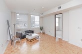 Located at 1709 Cresthill Ave in Royal Oak, Michigan, this single-floor residence offers a clean, modern aesthetic throughout. The living area is a standout space, featuring distinctive parquet hardwood flooring that adds warmth and character to the room. Large windows dressed with vertical blinds allow generous natural light to fill the space, creating a bright and welcoming atmosphere.

The kitchen is thoughtfully designed with warm maple cabinetry, dark countertops, and a full suite of stainless steel appliances including a range, microwave, and refrigerator. A peninsula with a breakfast bar provides both additional prep space and a casual dining option, while recessed track lighting illuminates the workspace effectively.

The bedrooms are carpeted for comfort, each benefiting from ample natural light through large windows with vertical blinds. The rooms offer a neutral palette with clean white walls, providing a versatile canvas for personalization.

The residence includes two bathrooms. The full bathroom features a soaking tub with tiled surround and white tile flooring, while a second bathroom serves as a convenient half or guest bath, equipped with a wood-cabinet vanity and dark countertop that coordinates with the kitchen's design. Together, these spaces deliver a cohesive and functional living environment in a desirable Royal Oak location.