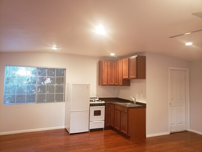 Kitchen view with stove setup. - 4966 Twining St