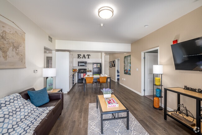 4BR, 4BA - 1,415SF - Kitchen/Living Room - GrandMarc at University Village Apartments