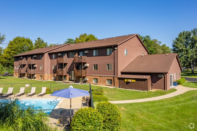 Pool, balconies overlooking pool and grounds - Chestnut Hills Apartments