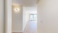 Located at 11817 Victory Blvd in Los Angeles, CA, this well-appointed one-bedroom, one-bathroom unit offers a thoughtfully designed layout across a single floor. Light wood-style flooring runs throughout, complementing the bright, neutral color palette that gives the space an open and airy feel. The combined living and dining area is generously sized, featuring a textured ceiling, large sliding glass doors that flood the room with natural light, and direct access to a private balcony. The galley-style kitchen is efficiently designed with white cabinetry accented by black hardware, granite-style countertops, stainless steel appliances including a gas range and refrigerator, and a single-basin sink. A hallway connects the main living area to the bedroom and bathroom, with four closets providing ample storage throughout the unit. The spacious primary bedroom features a sliding-door closet, a large window allowing natural light, and a textured ceiling. The bathroom includes a full tub-shower combo with clean white finishes and wood-style flooring. A hallway with overhead lighting and additional closet access completes the functional and cohesive layout of this Los Angeles residence.