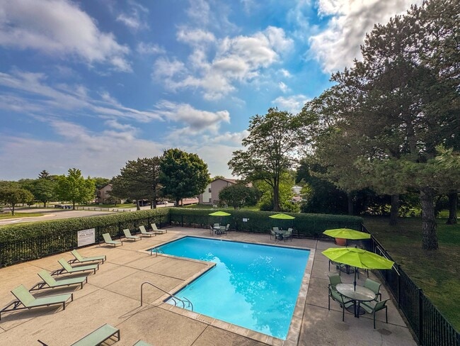Pool with sundeck at Woodland Villa Apartments in Westland, MI. - Woodland Villa Apartments