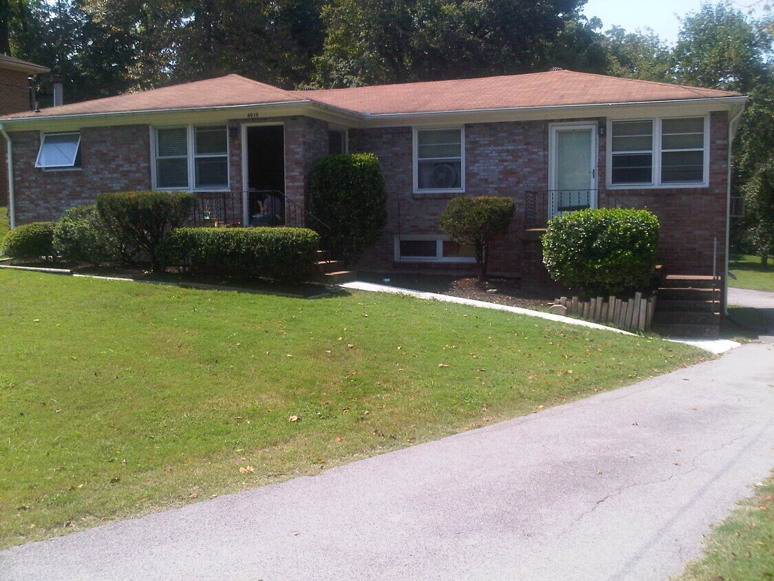 This listing for Unit A is the white door on the right. - 4915 Darlington Drive
