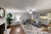 Located at 2900 S Gessner Road in Houston, TX, this 2-bedroom, 3-bathroom single-floor home offers a comfortable and functional layout. The living room serves as the heart of the home, showcasing rich hardwood-style flooring, a ceiling fan with light fixture, and a classic white fireplace that adds warmth and character. Natural light filters in through multiple windows with blinds, creating a bright and welcoming ambiance throughout.

The kitchen features a galley-style layout with grey cabinetry, a white subway tile backsplash, quartz-style countertops, a stainless steel sink, and matching white appliances — a clean, efficient space for everyday cooking.

Both bedrooms are carpeted and include ceiling fans, ample natural light, and walk-in closets. The spacious primary bedroom benefits from multiple windows and generous closet space. The second bedroom is equally comfortable with its own walk-in closet. Three full bathrooms serve the home, each featuring white tile surrounds and tub/shower combinations.

Additional highlights include a dedicated laundry area, a hallway connecting the living spaces, and neutral grey tones throughout that lend a modern, cohesive aesthetic to the entire home.