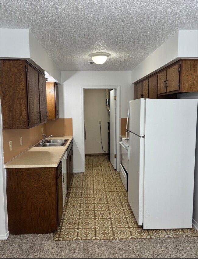 Kitchen - garbage disposal, dishwasher, stove and refrigerator - 5018 W 5th Pl