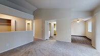 Located at 11220 Ninth Pl W in Everett, Washington, Unit 3 is a single-floor residence thoughtfully designed for comfortable everyday living. The open living area immediately draws the eye upward with striking vaulted ceilings that lend a sense of spaciousness and airiness throughout. Plush carpeting covers the generously sized living space, which is anchored by a classic tiled fireplace with a raised hearth — an inviting focal point for relaxing evenings. Sliding glass doors with vertical blinds allow natural light to fill the room.

The kitchen is well-appointed with warm oak cabinetry extending to the ceiling for abundant storage, a coil cooktop range with oven, a white refrigerator, a dishwasher, and a double sink beneath a window. A peninsula counter provides additional prep space and casual dining potential. Wood-look flooring throughout the kitchen adds a clean, durable finish. Conveniently, in-unit washer and dryer connections are accessible directly from the kitchen area.

The bedrooms are carpeted and bright, with one featuring vaulted ceilings and a built-in closet offering generous storage. The bathroom includes a wide vanity with oak cabinetry, a large mirror, and wood-look flooring. Baseboard heating is present throughout, ensuring year-round comfort in this well-laid-out Everett home.