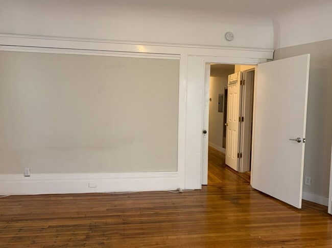 From far side of bedroom towards front door and bathroom. - 779 Bush St