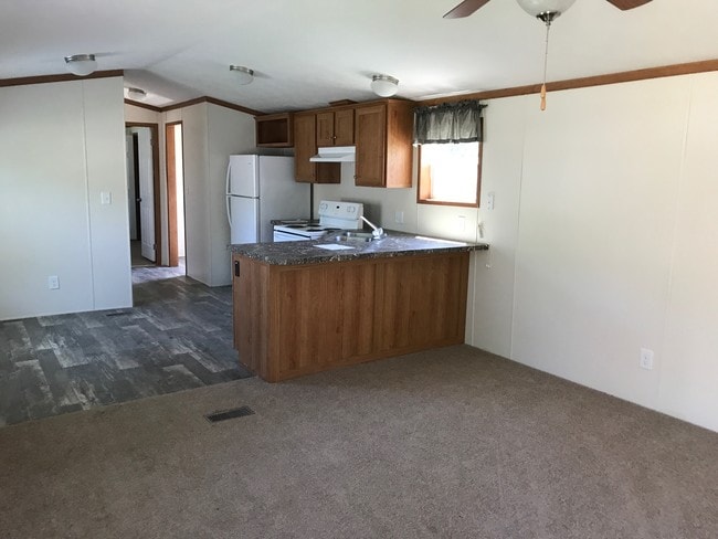 Living room to kitchen - 5502 Mt Morris Rd