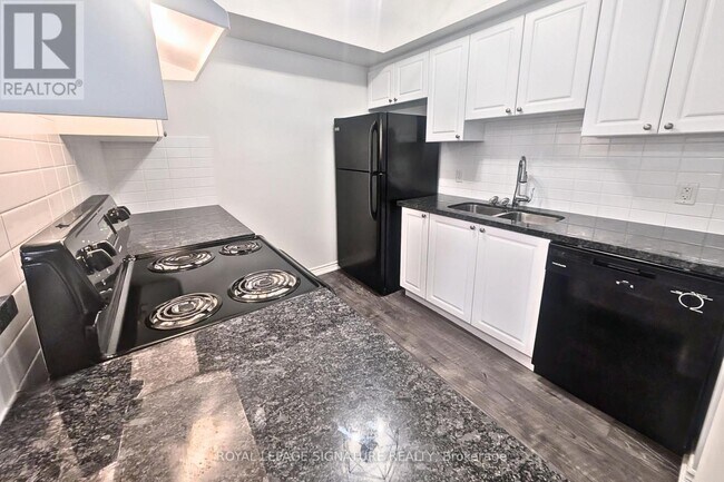 Photo du bâtiment - 100 Dean Ave