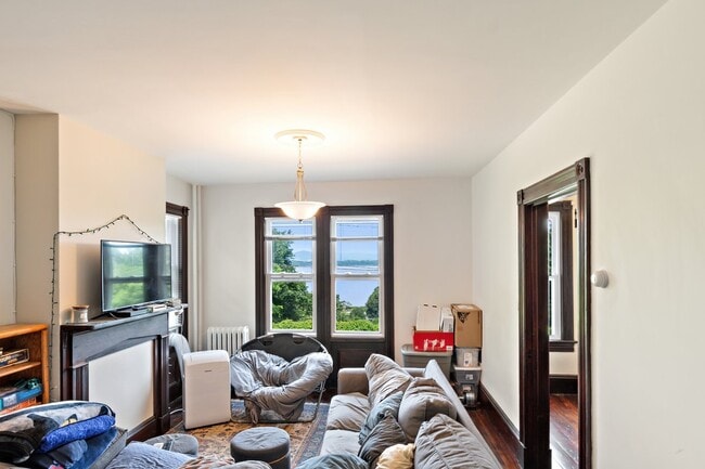Living room w river view - 3 Independence Pl