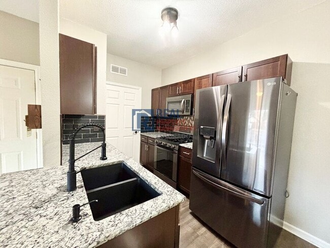 Photo - 5633 E Atlantic Pl Apartment