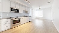 This 620 square foot apartment in Carson, CA, offers a thoughtful blend of comfort and contemporary design. The single-floor layout comprises one bedroom, one bathroom, and an open-concept living area. The primary bedroom, measuring a generous 190 square feet, provides ample space for relaxation and storage.

The kitchen is a highlight, boasting sleek white cabinetry, stainless steel appliances, and a subway tile backsplash. It features a full-size refrigerator, built-in microwave, and dishwasher, making it both functional and aesthetically pleasing. The light wood-look flooring in the kitchen and living area adds warmth and continuity to the space.

The bathroom showcases a modern vanity with a quartz countertop, undermount sink, and ample storage. A large mirror and good lighting enhance the sense of space. The bedroom, while not pictured in detail, likely features the same carpeting seen in other areas, providing a cozy feel.

Large windows in the living area and bedroom allow for plenty of natural light, while roller shades offer privacy when needed. The neutral color palette throughout the apartment creates a bright, airy atmosphere that can easily accommodate various decor styles.

Despite its compact size, this apartment efficiently utilizes every square foot, offering a comfortable living space in an urban setting.