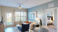 Located at 7590 Heron Cir in Vero Beach, Florida, this single-story 2-bedroom, 2-bathroom home offers a thoughtfully designed layout with modern finishes throughout. The open-concept living, dining, and kitchen area serves as the heart of the home, featuring light wood-style flooring, soft blue-grey accent walls, and ceiling fans that enhance the airy Florida ambiance. Large windows flood the living space with natural light, offering pleasant outdoor views.

The kitchen is well-equipped with white shaker-style cabinetry, granite countertops, a subway tile backsplash, and stainless steel appliances, including a refrigerator, range, and microwave. A dedicated dining area flows seamlessly from the kitchen and living room.

Both bedrooms feature plush carpeting, ceiling fans, accent walls in calming muted tones, and generous windows. The spacious primary bedroom includes ample closet space and an en-suite bathroom. Bathrooms are finished with white cabinetry, granite countertops, and clean tile work.

The home also includes a dedicated laundry area, five closets providing abundant storage, and a private patio. With its cohesive coastal-inspired palette and functional layout, this home offers comfortable living in a serene Vero Beach setting.