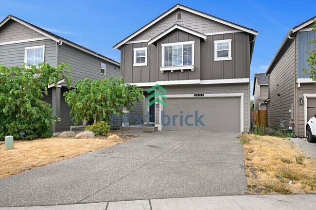 Foto del edificio - "Charming 4-Bedroom Home in Puyallup with Spacious 1831 Sq Ft Layout & 2.5 Baths!"