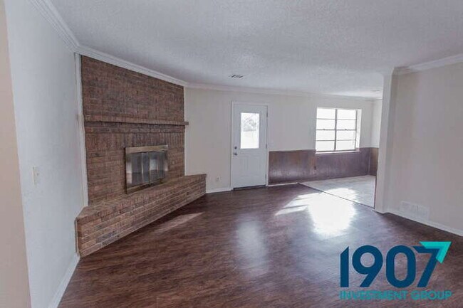 Building Photo - Spacious 4-Bedroom Home with Charming Brick Fireplace and Updated Flooring in Moore!