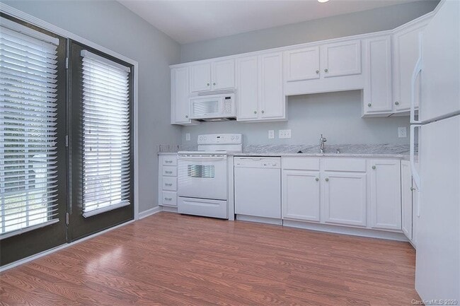 Kitchen with doors to the patio. - 219 Township Dr