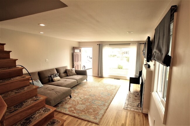 Facing front door and front yard. Parking for 2 cars on driveway. - 765 Avenue A