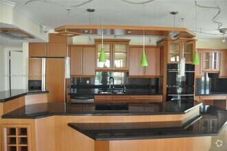 Building Photo - 8877 Collins Ave