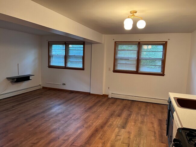 Living room area, north-facing windows look onto backyard - 135 Collard St