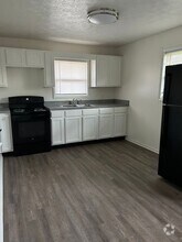 Building Photo - 7015-7017 Manor Dr N