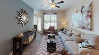 Located at 811 Polo Rd in Columbia, SC, this single-story residence offers a thoughtfully designed layout with a warm, neutral color palette and consistent finishes throughout. The living room serves as a comfortable gathering space, featuring wood-style flooring, a ceiling fan, large windows that invite natural light, and a distinctive accent wall that adds visual depth to the room.

The kitchen is equipped with white cabinetry, granite-style countertops, black appliances including a range and refrigerator, and a double sink — combining functionality with a clean, modern aesthetic. Adjacent to the kitchen, a dedicated dining area features wood-style flooring and pendant lighting, creating an inviting space for meals.

The bedrooms are carpeted and well-lit, each featuring ceiling fans and large windows with blinds. The primary bedroom connects directly to a private en-suite bathroom and includes a built-in closet with wire shelving for ample storage. Additional bathrooms are finished with granite-style countertops, wood-style flooring, and a tub-shower combination. Throughout the home, consistent trim work, neutral wall tones, and thoughtful layouts create a cohesive and comfortable living environment.